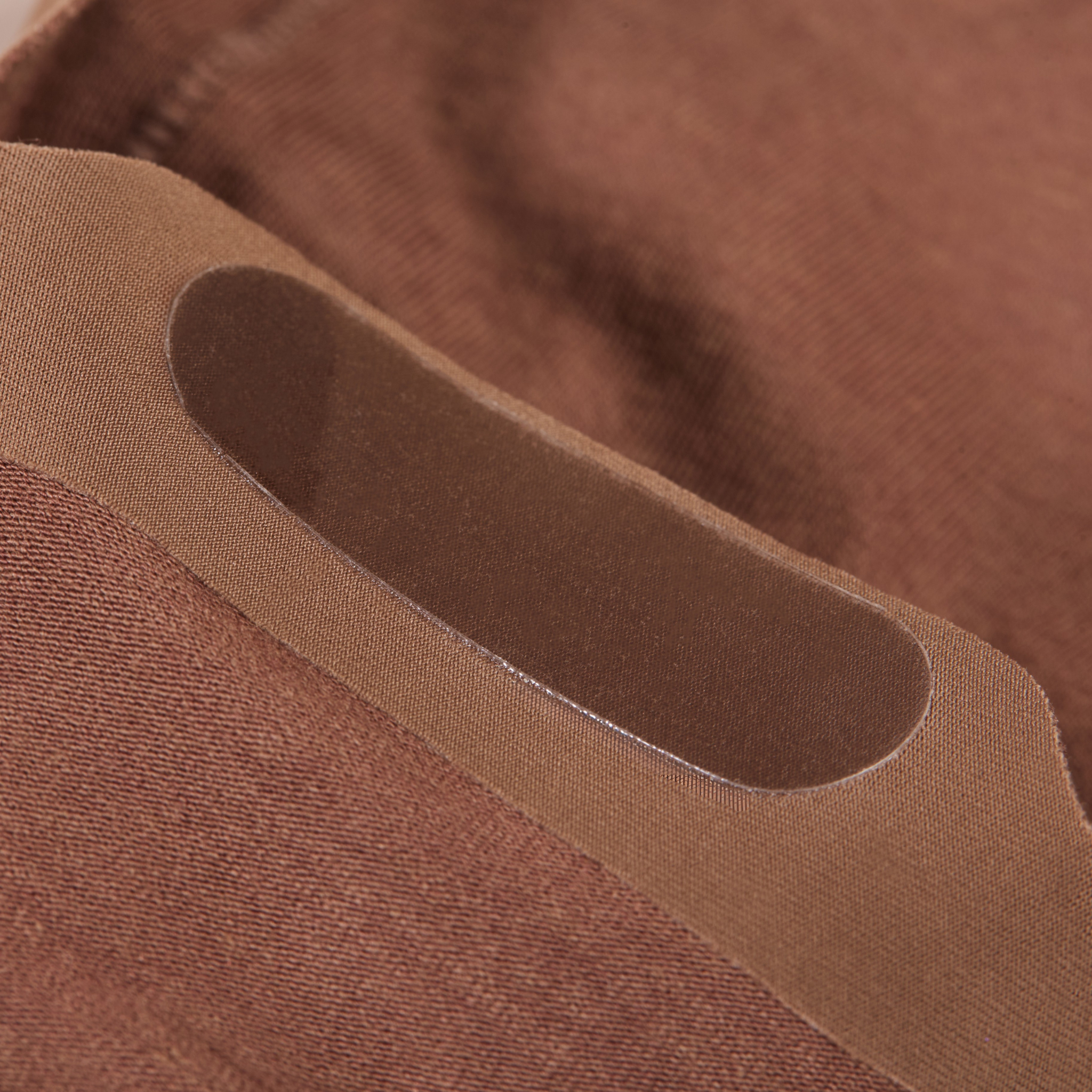 Close-up of brown fabric with a focus on its ultra thin grip construction